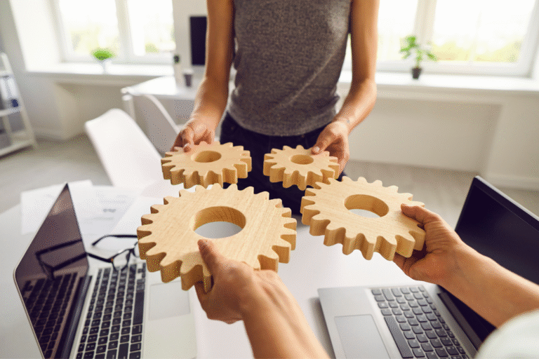 People holding connecting gears symbolizing enterprise integrations.